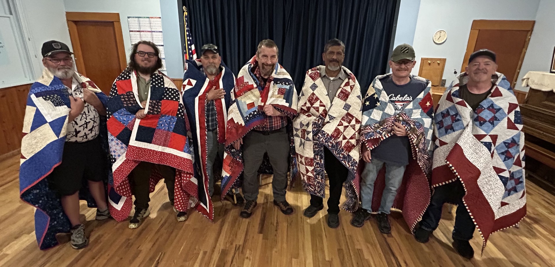 Local veterans wrapped in their handmade Quilts of Valor, presented by Canyon County Quilters